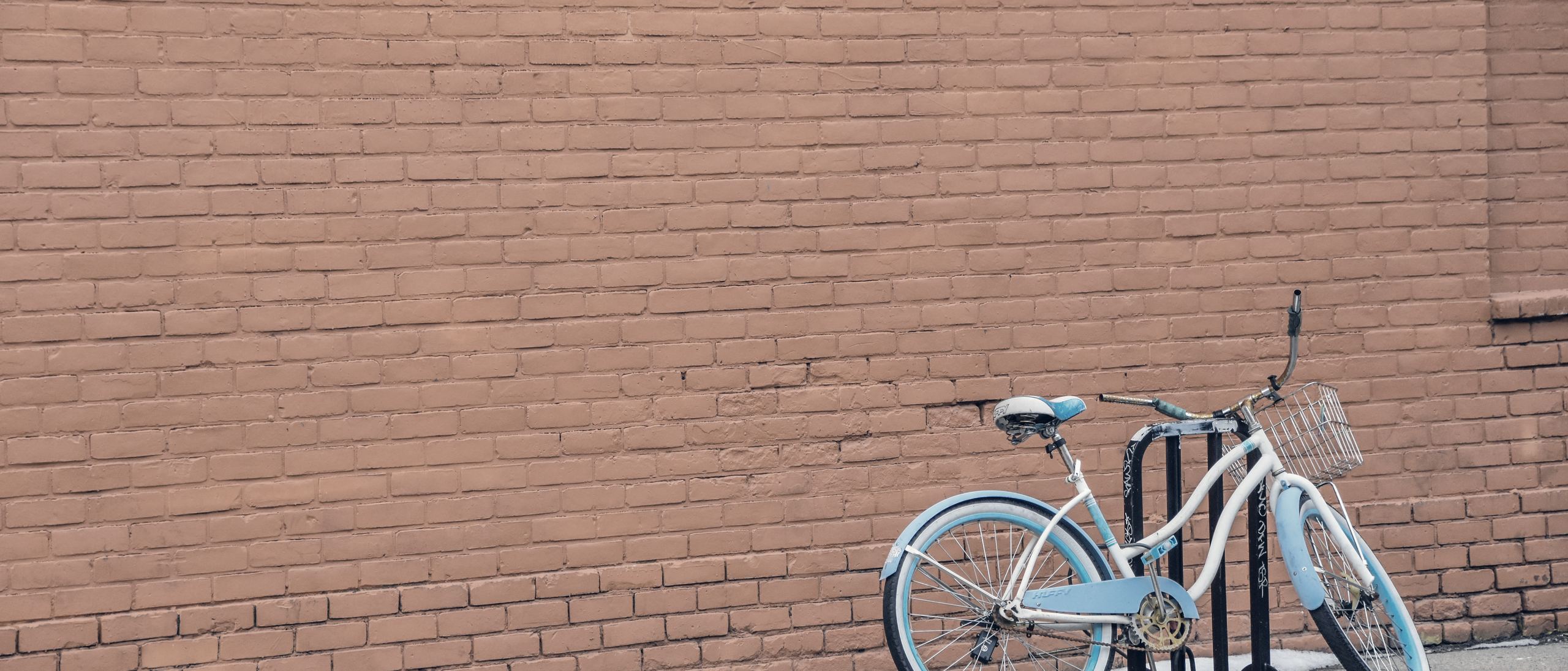 A bicycle against a brick wall in Eastern Market, Detroit.