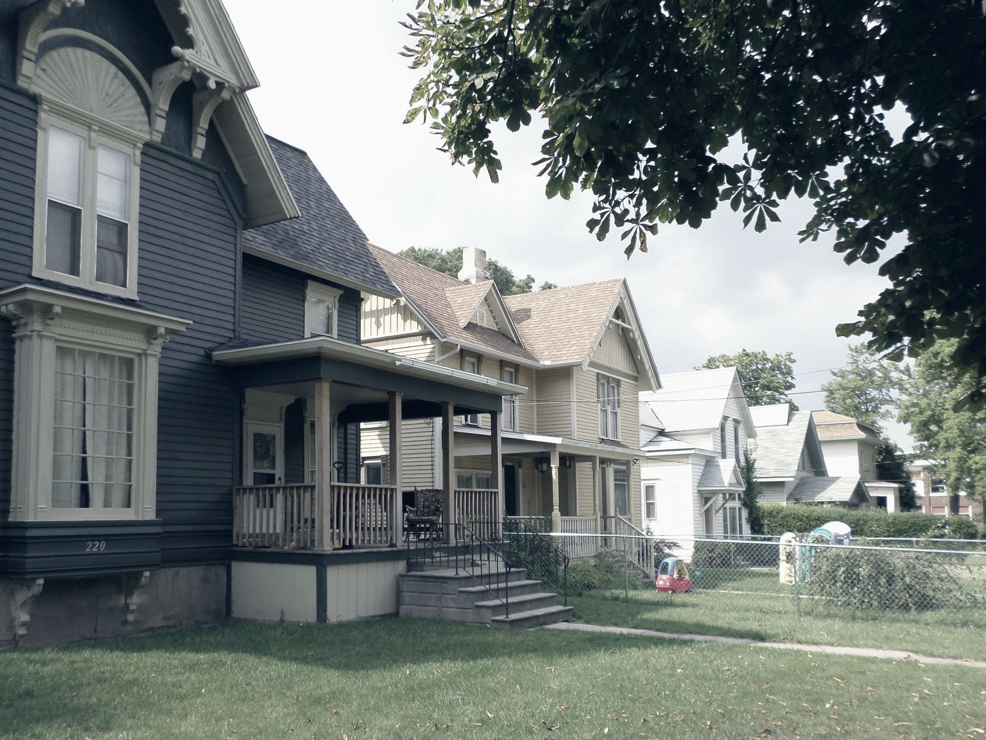 Front porches on a Michigan street in summer.